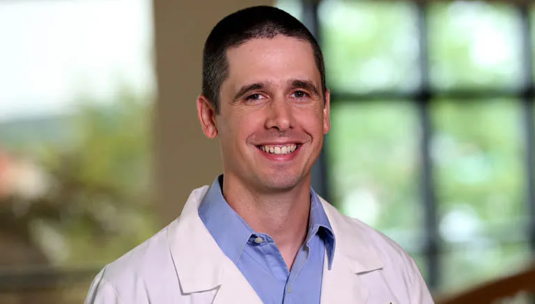 Dr. Justin Benson Clayton