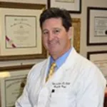 Dr Robert J. Troell, M.D., F.A.C.S.