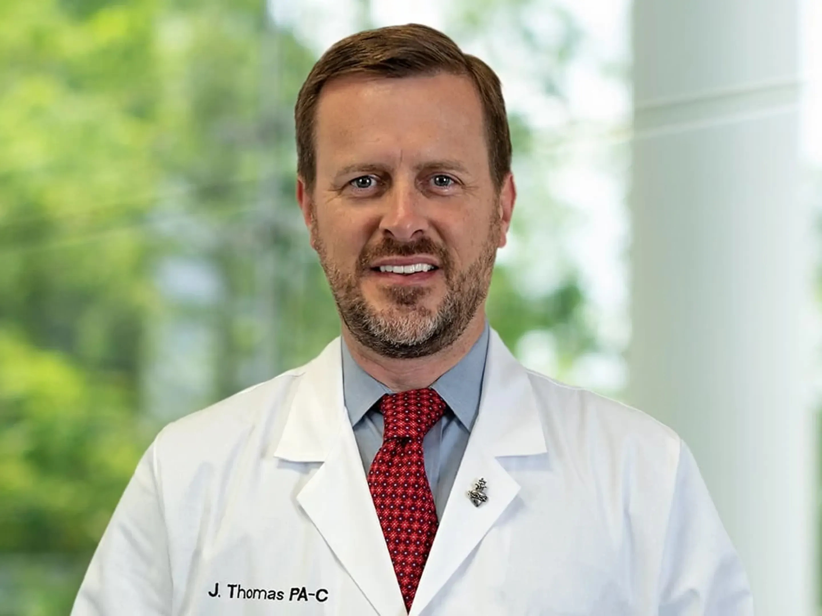 Dr. J Ryan Thomas