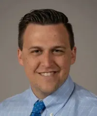 Dr. Christopher M Robison, DO