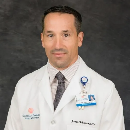 Dr. Justin Whitlow,