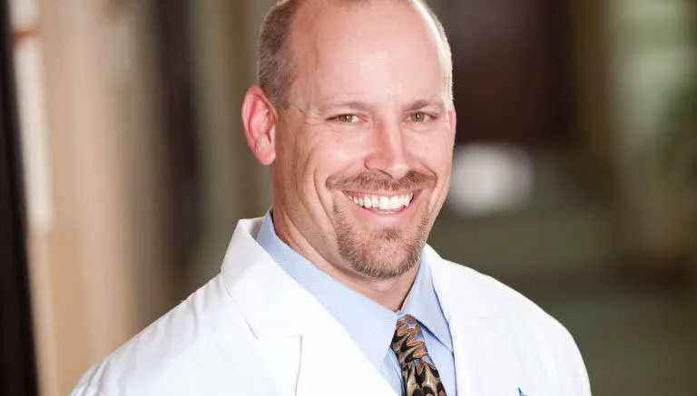 Dr. Christopher Simpson