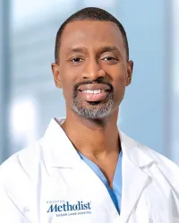 Dr. Toussaint Smith, MD